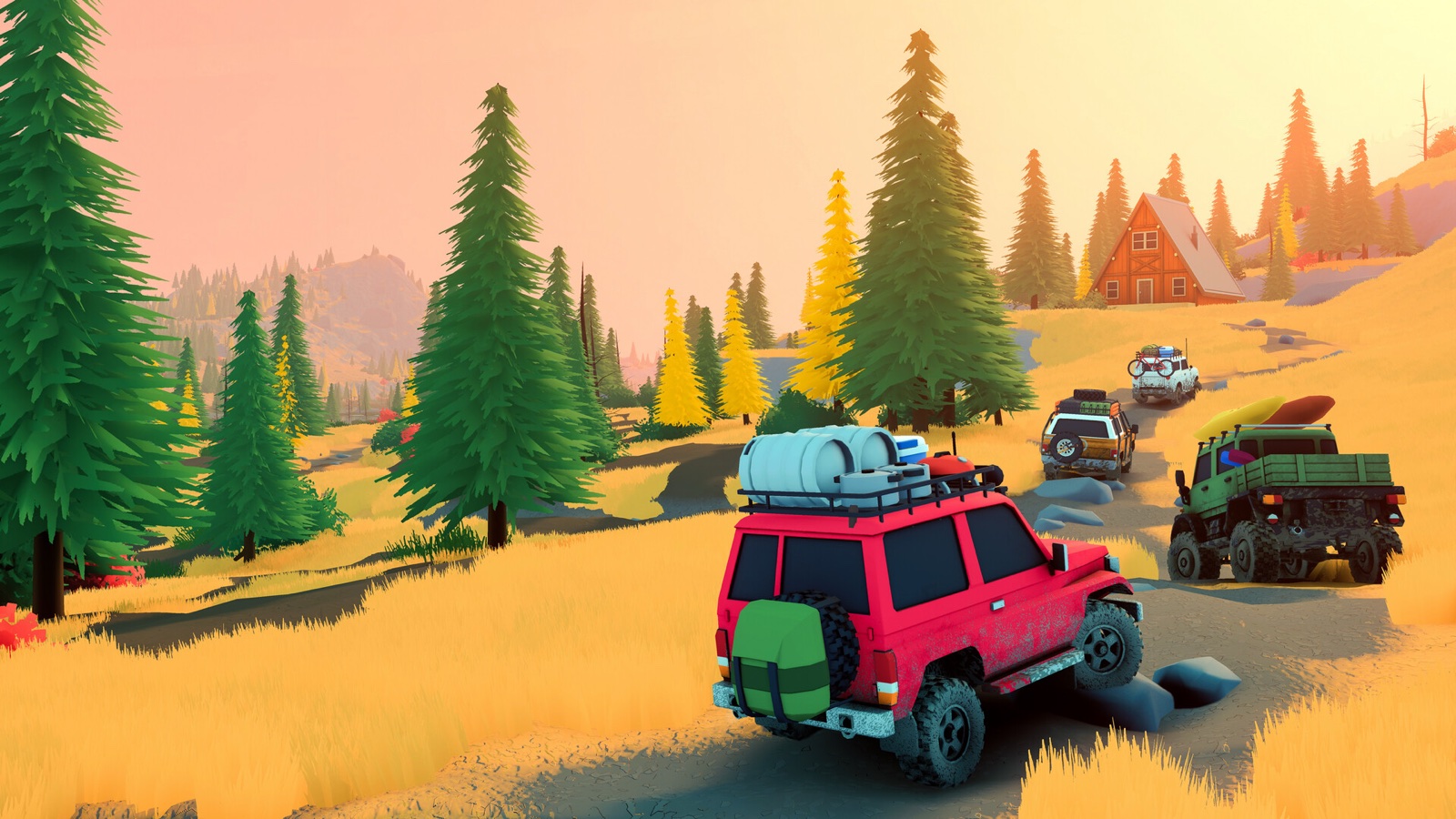 A convoy of four loaded 4x4s rolling along an autumn trail